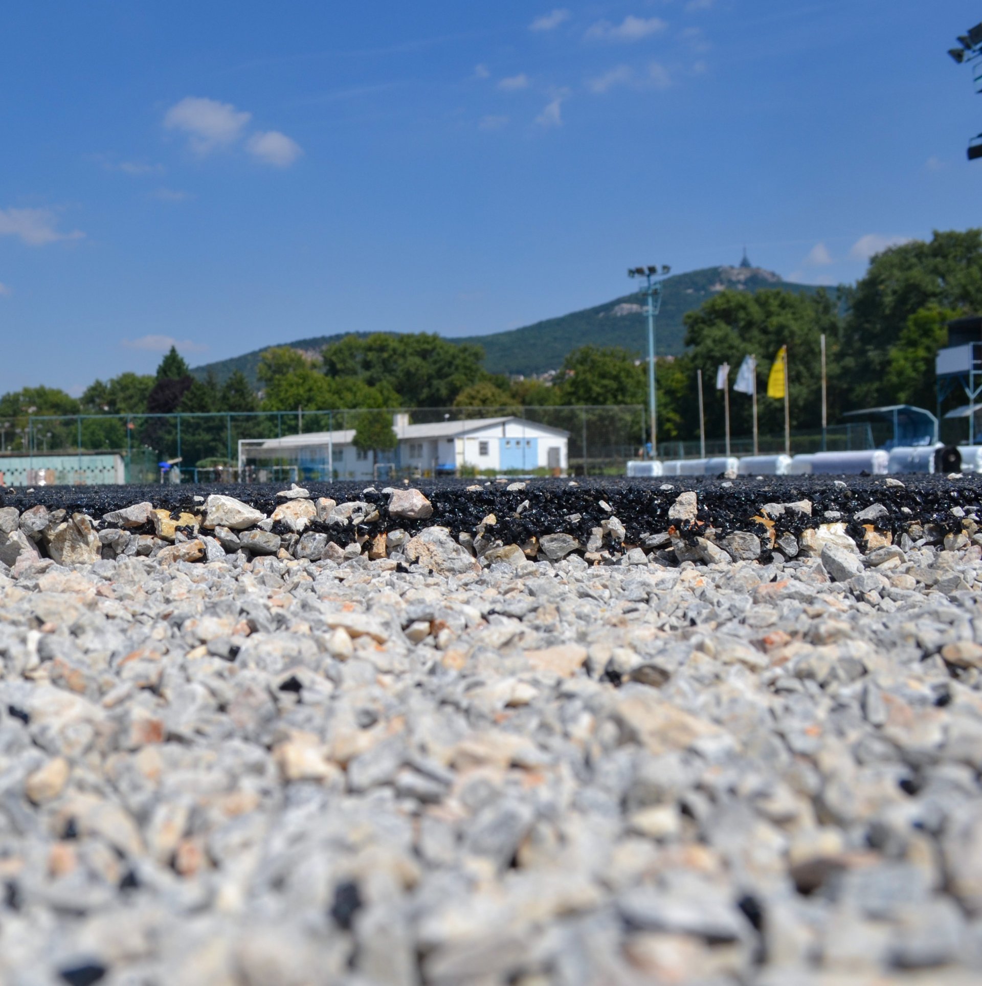 Black-brown EPDM rubber granulate on a football pitch